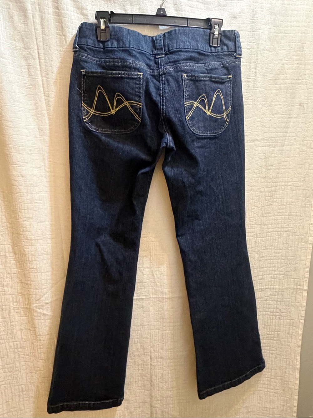 New York & Company Dark Blue Boot Cut Jeans with Yellow Back Stitching